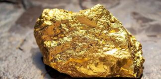 Oro cierra con ganancias tras recorte de tasas de la Fed y fortaleza de la demanda de refugio