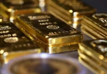 Oro cae a mínimos de seis semanas por presión de tasas altas y fortaleza del dólar